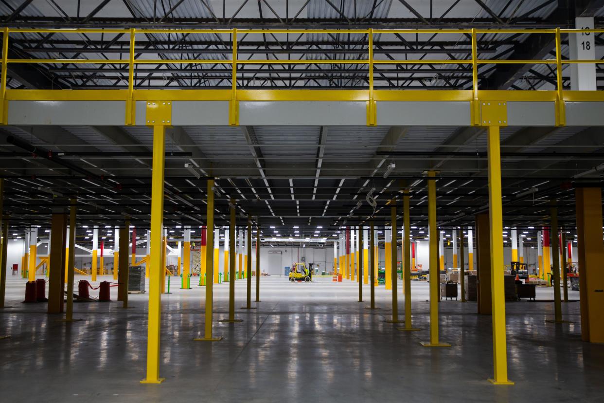 Construction work takes place on the first floor of Amazon's unfinished Elkhart Robotics Fulfillment Center on Thursday, May 9, 2024.  The facility will have miles of conveyors and a couple of hundred robots to help move products.