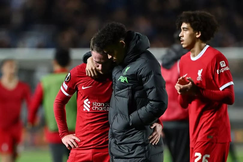 Alexis Mac Allister is consoled by team mate Luis Diaz following their side's elimination from the Europa League at Stadio Atleti Azzurri d'Italia on April 18, 2024 in Bergamo, Italy -Credit:Photo by Dan Mullan/Getty Images