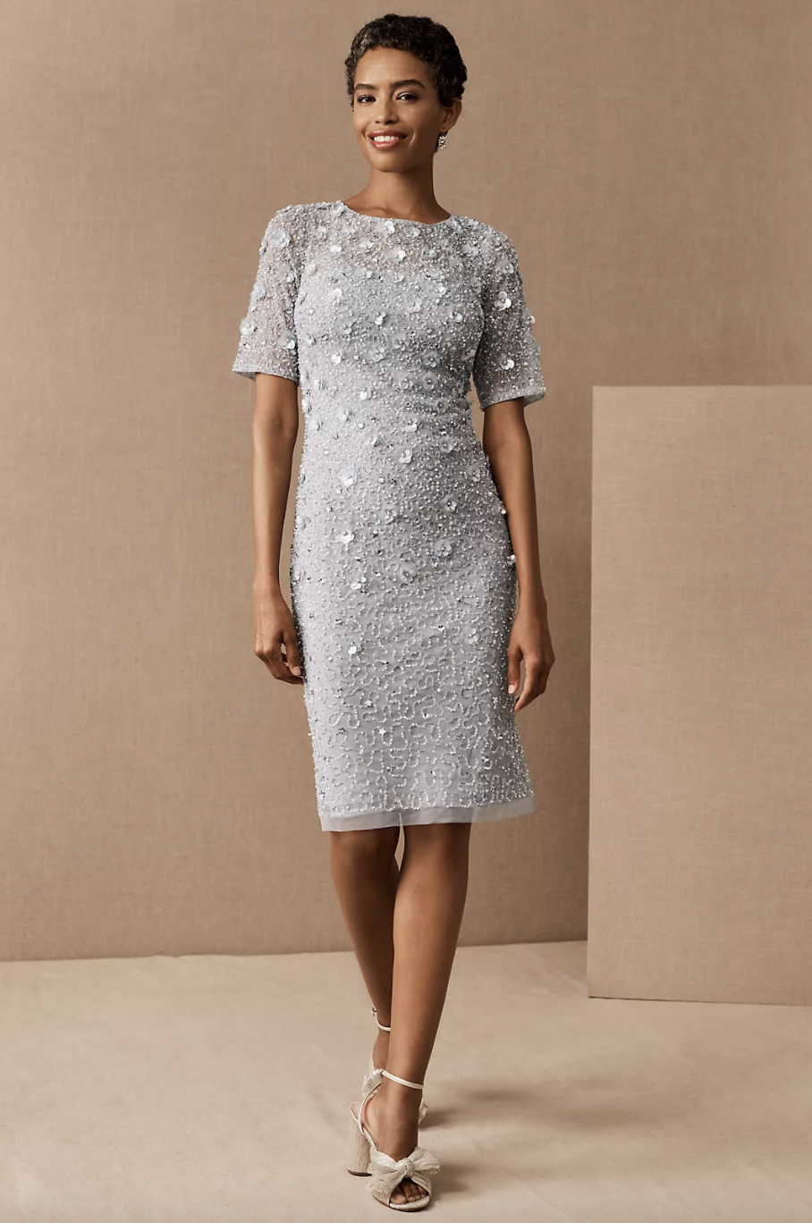 black model with short hair wearing light grey Adrianna Papell Petaluma Sequin Dress (Photo via Anthropologie)