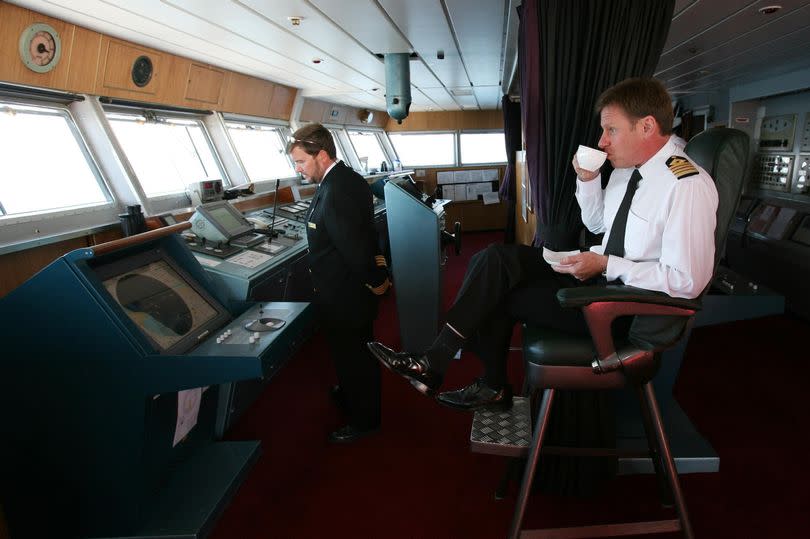 QE2 Captain Ian McNaught monitors the Bridge as the QE2 sails to Newcastle from Southampton on her 40th anniversary cruise around Britain in 2007