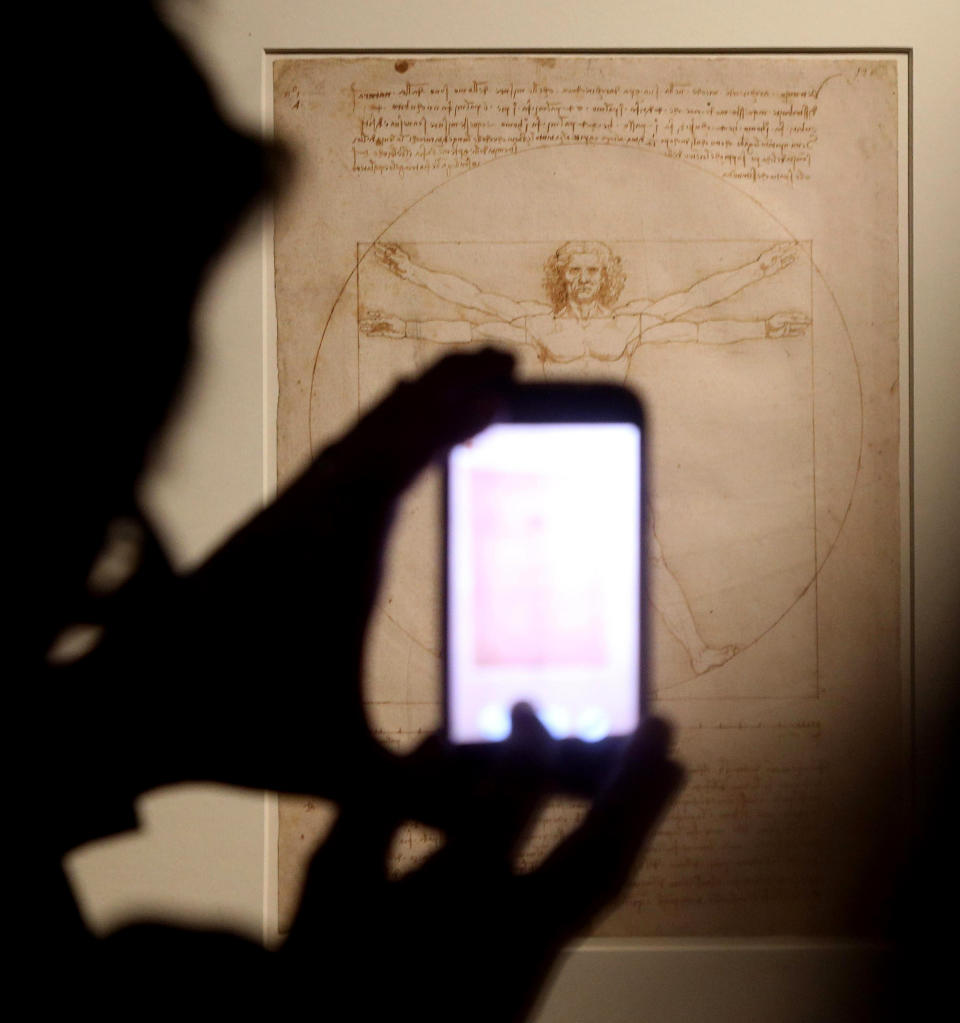 This Tuesday April 14, 2015 photo made available Tuesday Oct. 8, 2019 shows Leonardo da Vinci's "Vitruvian Man" during an exhibition in Milan, Italy. An administrative court in Venice has temporarily suspended Tuesday Oct. 8, 2019 the loan of Leonardo da Vinci's "Vitruvian Man" to the Louvre for an exhibition that is set to open later this month. (Matteo Bazzi/ANSA via AP)