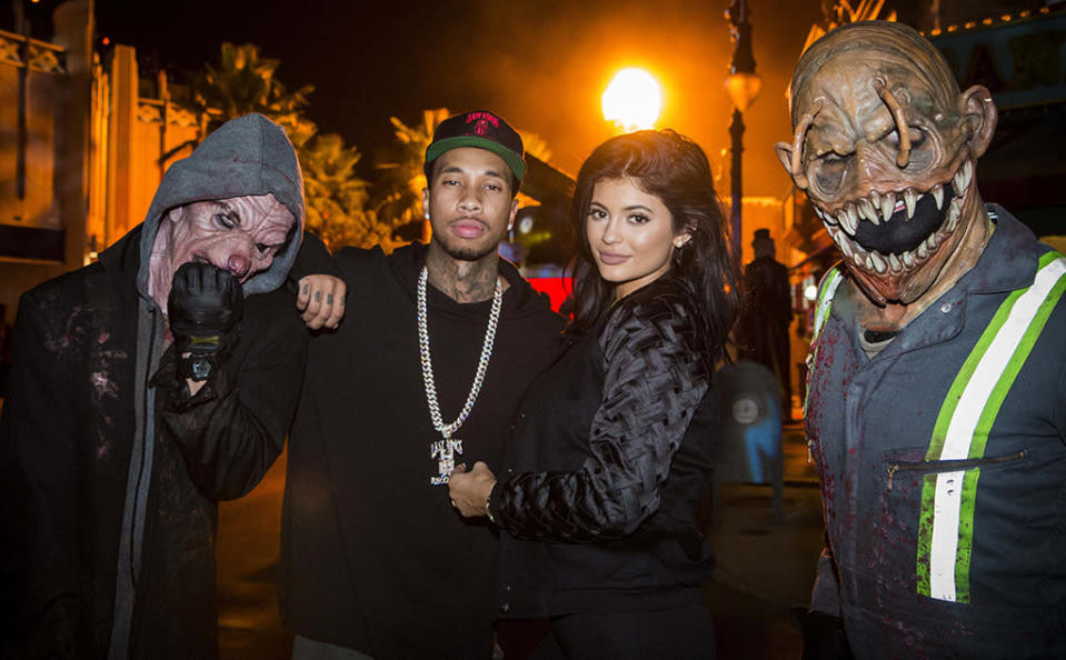 Always ready for their close-up, Kylie Jenner and boyfriend Tyga struck a pose like all was well around them. Um, guys? Might want to back away from the questionable characters beside you. (Courtesy of NBC Universal)