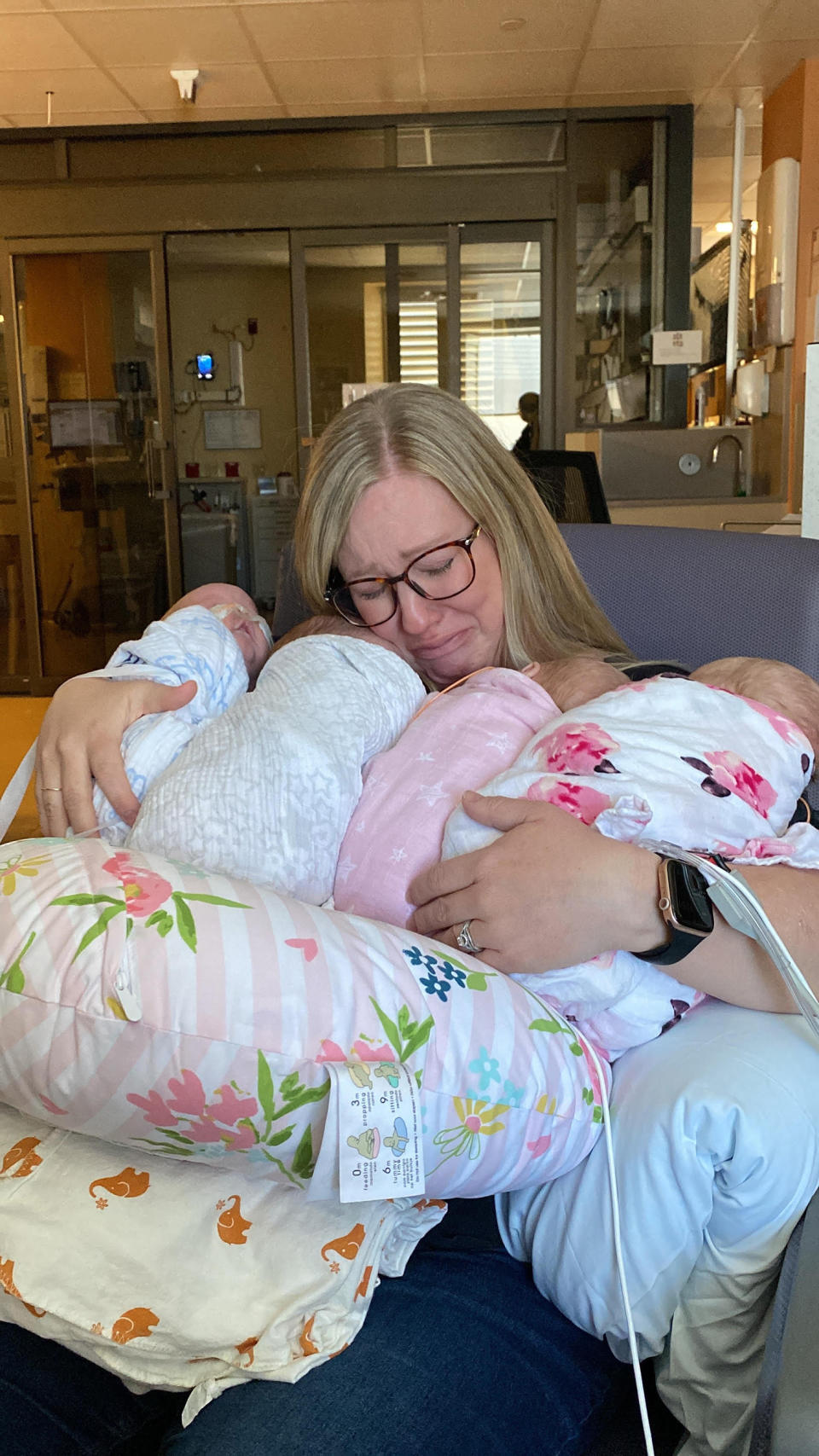 Ashley Crandell holding her quadruplets for the first time. (Courtesy the Crandell family)