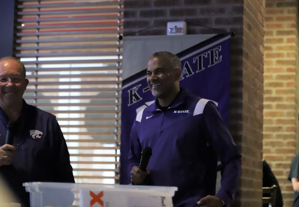 Kansas State basketball coach Jerome Tang, right, addresses the crowd while master of ceremonies Wyatt Thompson looks on during Wednesday's Catbacker tour stop at AJ's Sports Grill in Hutchinson.