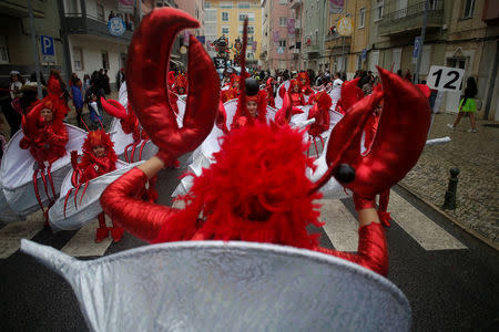 Carnival participants march during a parade in Torres Vedras, Portugal February 11, 2018. REUTERS/Pedro Nunes