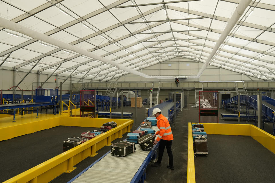 The "baggage factory", where athletes' luggages for the Paris 2024 Olympic Games will be collected, are seen in Charles de Gaulle airport, in Roissy-en-France, north of Paris, Tuesday, April 23, 2024 in Paris. (AP Photo/Thibault Camus)