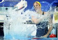 Australia's Emily Seebohm celebrates after winning gold in women's 200m backstroke final at the Aquatics World Championships in Kazan, Russia, August 8, 2015. REUTERS/Hannibal Hanschke