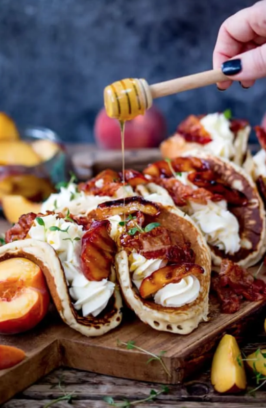 <p>Kitchen Sanctuary</p><p>Pancake tacos with caramelized peaches and pancetta are a dream, alongside lashings of whipped cream.</p><p><strong>Get the recipe: <a href="https://www.kitchensanctuary.com/pancake-tacos-caramelized-peaches-pancetta/" rel="nofollow noopener" target="_blank" data-ylk="slk:Pancake Tacos with Caramelized Peaches and Pancetta;elm:context_link;itc:0;sec:content-canvas" class="link rapid-noclick-resp"><em>Pancake Tacos with Caramelized Peaches and Pancetta</em></a></strong></p>