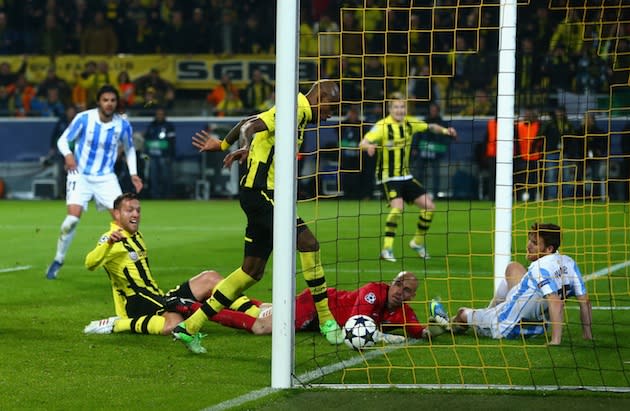 The moment Dortmund scored their second injury-time goal to stun Malaga and  prompt 'racism' claim