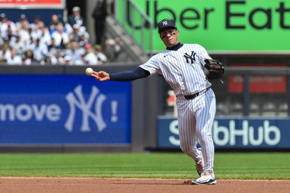 Apr 20, 2024; Bronx, New York, USA; New York Yankees second base Jahmai Jones (14) fields a ground ball and throws to first base for an out during the first inning against the Tampa Bay Rays at Yankee Stadium. Mandatory Credit: John Jones-USA TODAY Sports