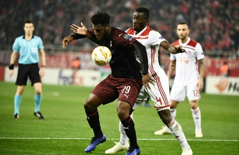 Olympiakos' Mohamed Camara (R) vies for the ball with Milan's Franck Kessie as the Italians crashed out of the UEFA Europa league