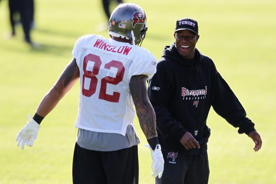 BAGSHOT, ENGLAND - OCTOBER 20:  Head coach Raheem Morris (R) speaks to Kellen Winslow at the Tampa Bay Buccaneers Training Session held at Pennyhill Park on October 20, 2011 in Bagshot, England.  (Photo by Dean Mouhtaropoulos/Getty Images)