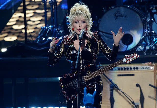 <p>Jeff Kravitz/FilmMagic</p> Dolly Parton performing in Los Angeles in November 2022