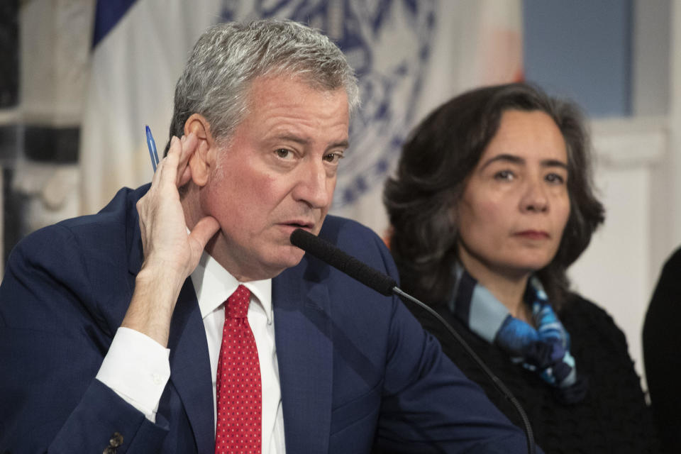 New York City Mayor Bill De Blasio, left, and Dr. Oxiris Barbot, commissioner of the NYC Department of Health and Hygiene, during a press conference on March 19, 2020. / Credit: Mark Lennihan / AP