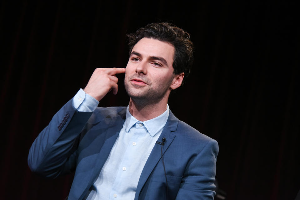 Aidan Turner speaks on stage during the Masterpiece 