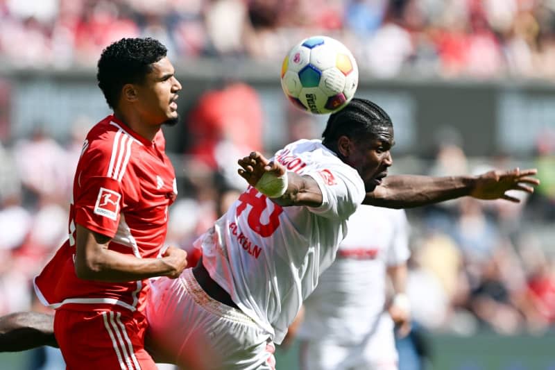 Cologne's Faride Alidou (R) and Berlin's Danilho Doekhi battle for the ball during the German Bundesliga soccer match between 1. FC Cologne and 1. FC Union Berlin at the RheinEnergieStadion. Federico Gambarini/dpa