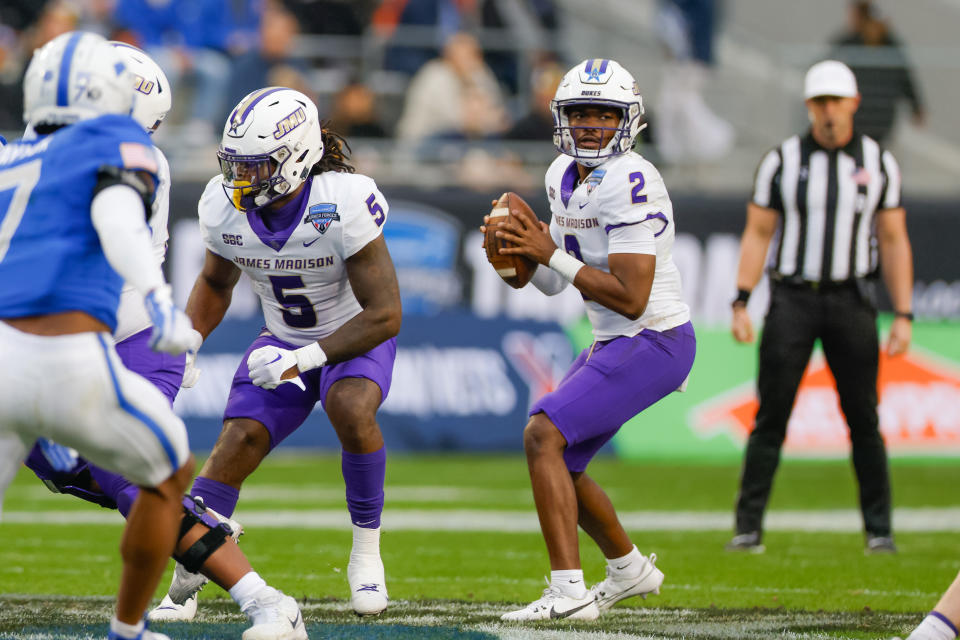 Dec 23, 2023; Fort Worth, TX, USA; James Madison Dukes quarterback Jordan McCloud (2) drops back to pass during the third quarter against the Air Force Falcons at Amon G. Carter Stadium. Mandatory Credit: Andrew Dieb-USA TODAY Sports