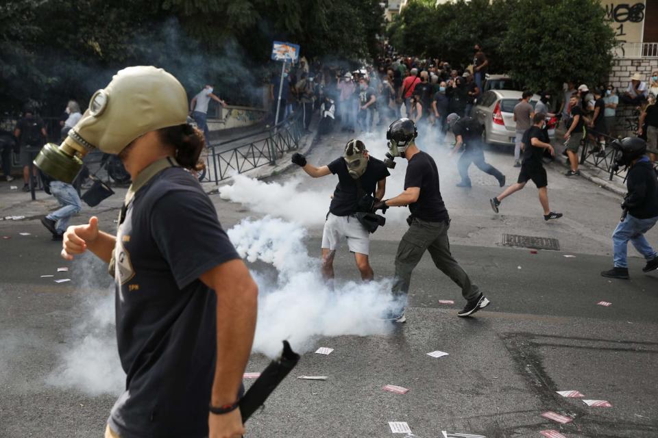 Police fired teargas into crowds of protesters gathered outside the courthouse following Wednesday's rulings, according to witnesses at the scene (Reuters)