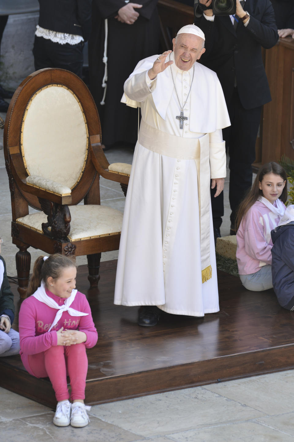 Pope Francis greets faithful as he celebrates Mass at Loreto's cathedral, central Italy, Monday, March 25, 2019. Francis has traveled to a major Italian pilgrimage site dedicated to the Virgin Mary to sign a new document dedicated to today's youth. (AP Photo/Sandro Perozzi)