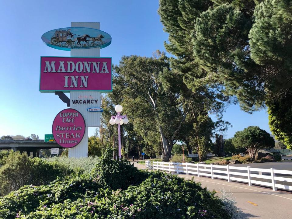 Sign Next to the Freeway is Very Pink madonna inn