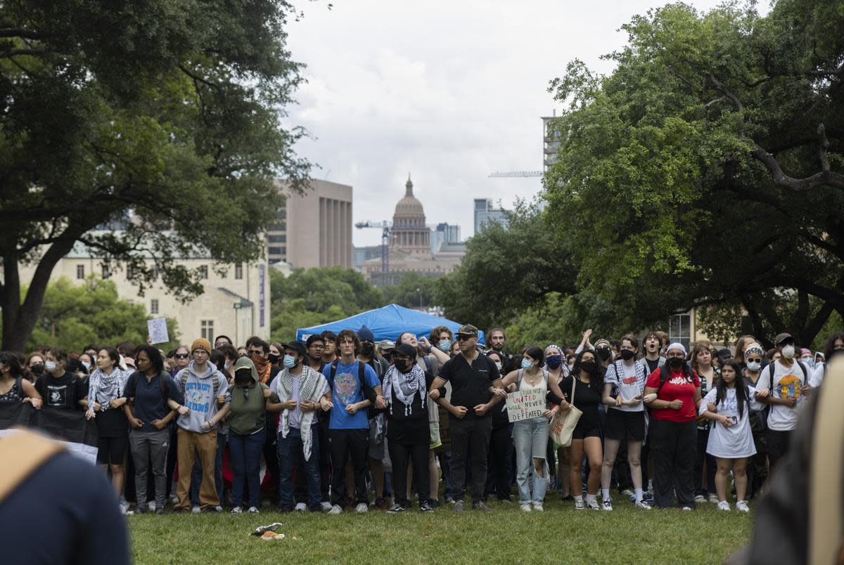 Protesters link arms on the campus of UT-Austin on April 24, 2024.