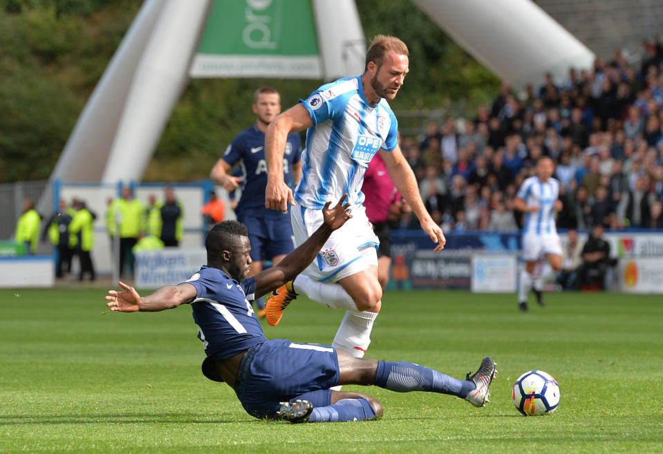 <p>Huddersfield Town’s Laurent Depoitre in action with Tottenham’s Davinson Sanchez(REUTERS/Peter Powell) </p>