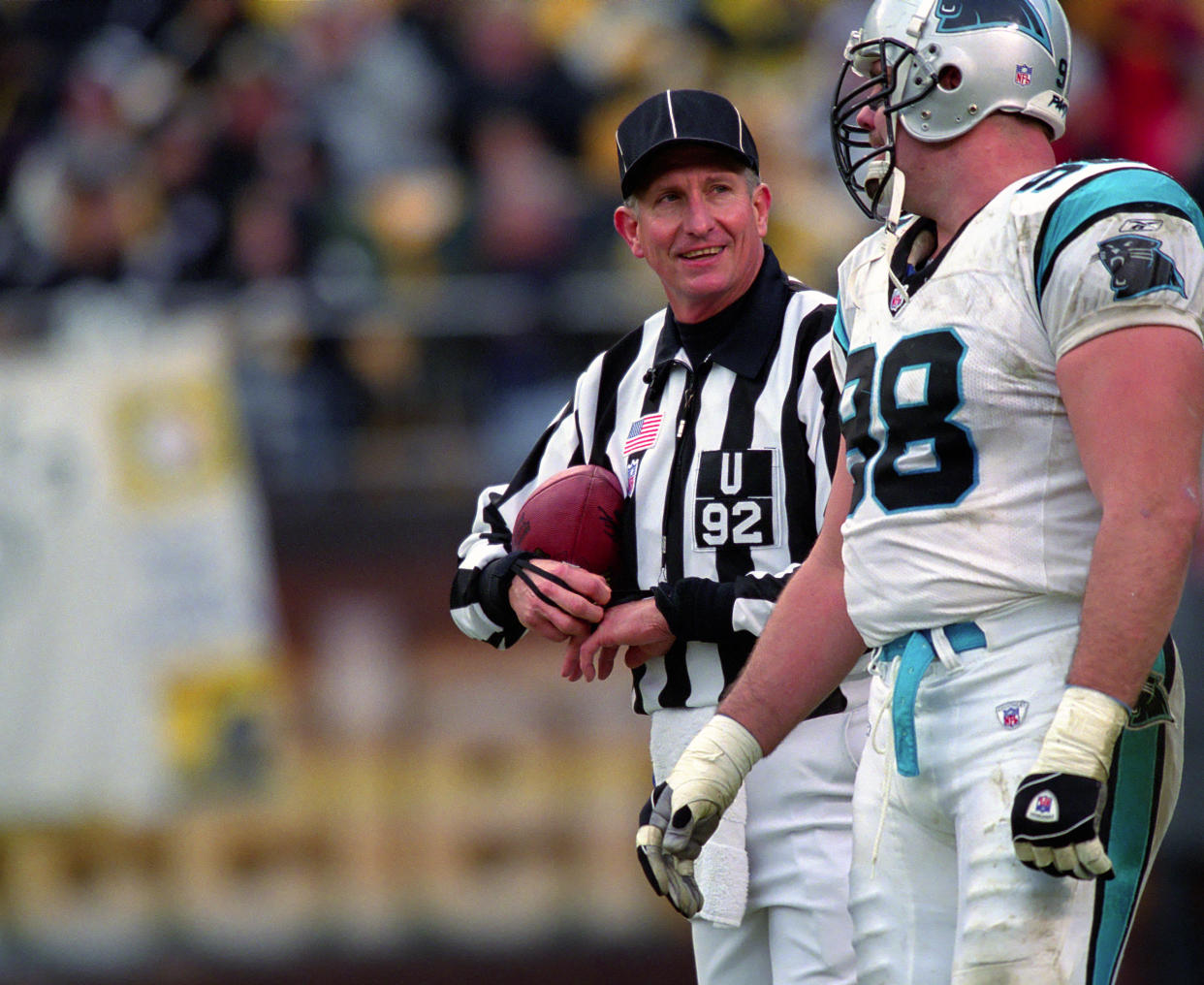 PITTSBURGH, PA - DECEMBER 15:  National Football League umpire Carl Madsen #92 talks to defensive lineman Shane Burton #98 of the Carolina Panthers during a game against the Pittsburgh Steelers at Heinz Field on December 15, 2002 in Pittsburgh, Pennsylvania.  The Steelers defeated the Panthers 30-14.   (Photo by George Gojkovich/Getty Images)