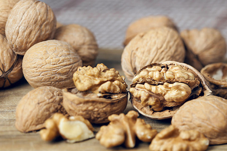 <p>A small handful of walnuts every day delivers a healthy dose of omega-3 fatty acids, alpha-linolenic acid, melatonin, copper, manganese, and the hard-to-find gamma-tocopherol form of vitamin E, which helps protect your heart, according to Lipman. “Walnuts on your plate may also protect your brain and help slow the onset of Alzheimer’s and Parkinson’s disease,” he says.</p><p><i>(Photo: Stocksy)</i><br></p>