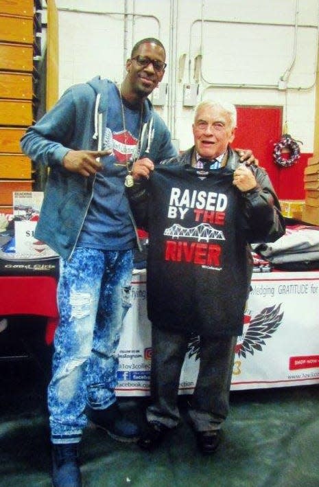 Jim Rogers at a past Christmas Arts and Crafts Fair with T-shirt artist Shawn Thames. [Courtesy photo]