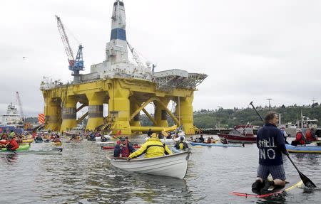 Activists protest the Shell Oil Company's drilling rig Polar Pioneer which is parked at Terminal 5 at the Port of Seattle, Washington May 16, 2015. REUTERS/Jason Redmond