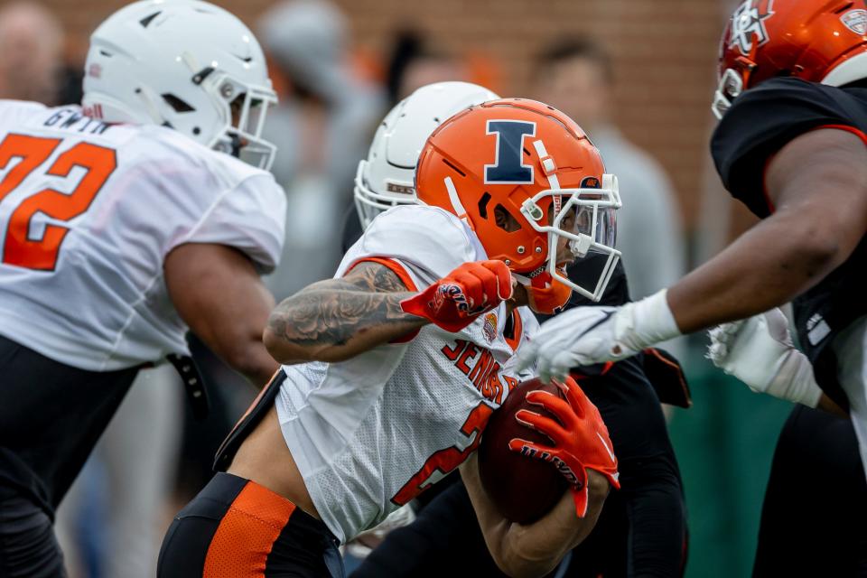 Running back Chase Brown of Illinois (2) runs the ball during the third day of Senior Bowl week.