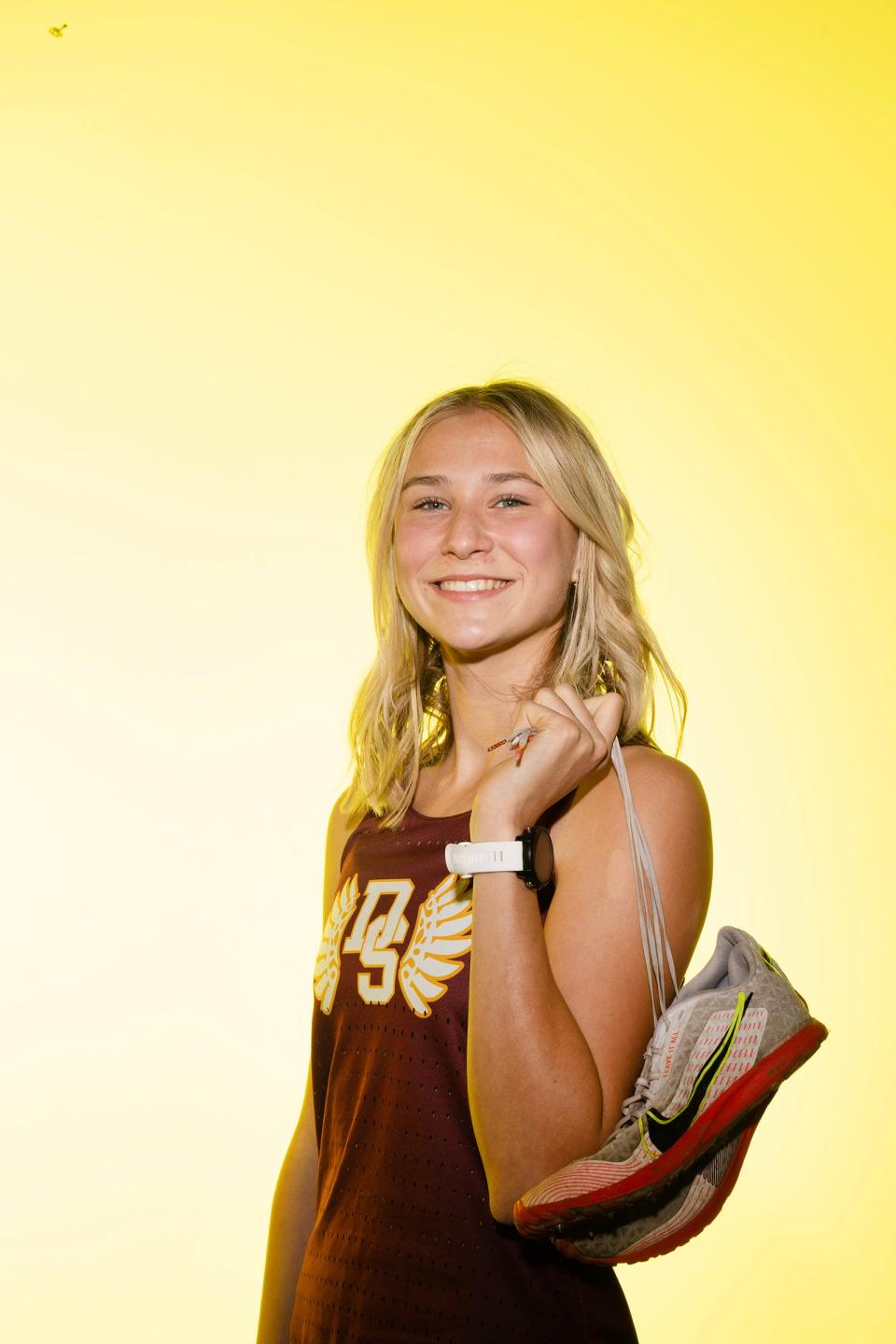 Lucy Fredenburg of the Dripping Springs High School track and field team got her start in running by watching her dad train for ultra marathons. She aspires to run track and cross-country in college, perhaps at Baylor.