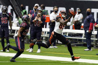 Cincinnati Bengals wide receiver Tee Higgins (85) catches a pass for a first down as Houston Texans cornerback Vernon Hargreaves III (26) defends during the first half of an NFL football game Sunday, Dec. 27, 2020, in Houston. (AP Photo/Eric Christian Smith)