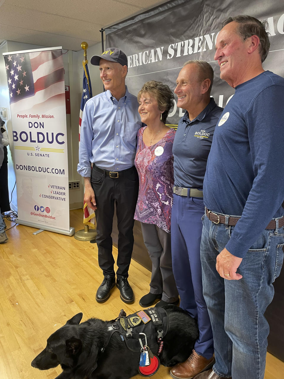 Sen. Rick Scott, R-Fla., chairman of the National Republican Senatorial Committee, poses for photos as he campaigns alongside New Hampshire Republican Senate candidate Don Bolduc, second from right, in Atkinson, N.H. on Sunday, Oct. 30, 2022. (AP Photo/Steve Peoples)