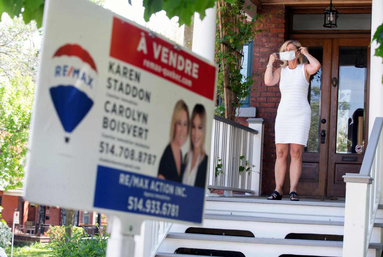 Canada real estate: Real estate agent Karen Staddon puts on a mask as she prepares for a client's visit at a home for sale, amid the coronavirus disease (COVID-19) outbreak, in Montreal, Quebec, Canada June 5, 2020. REUTERS/Christinne Muschi