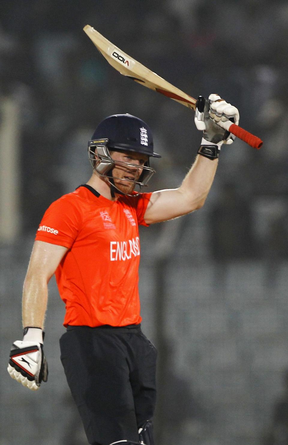 England's Eoin Morgan acknowledges the crowd after scoring a half century during their ICC Twenty20 Cricket World Cup match in Chittagong, Bangladesh, Thursday, March 27, 2014. (AP Photo/A.M. Ahad)
