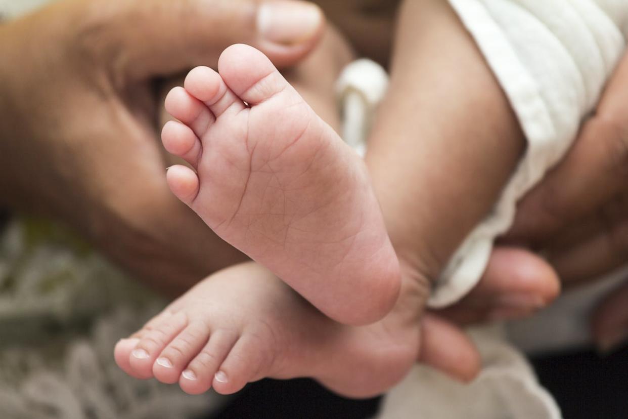   <span class="attribution"><a class="link " href="https://www.shutterstock.com/image-photo/baby-feet-moms-hand-on-white-177099479" rel="nofollow noopener" target="_blank" data-ylk="slk:Shutterstock;elm:context_link;itc:0;sec:content-canvas">Shutterstock</a></span>