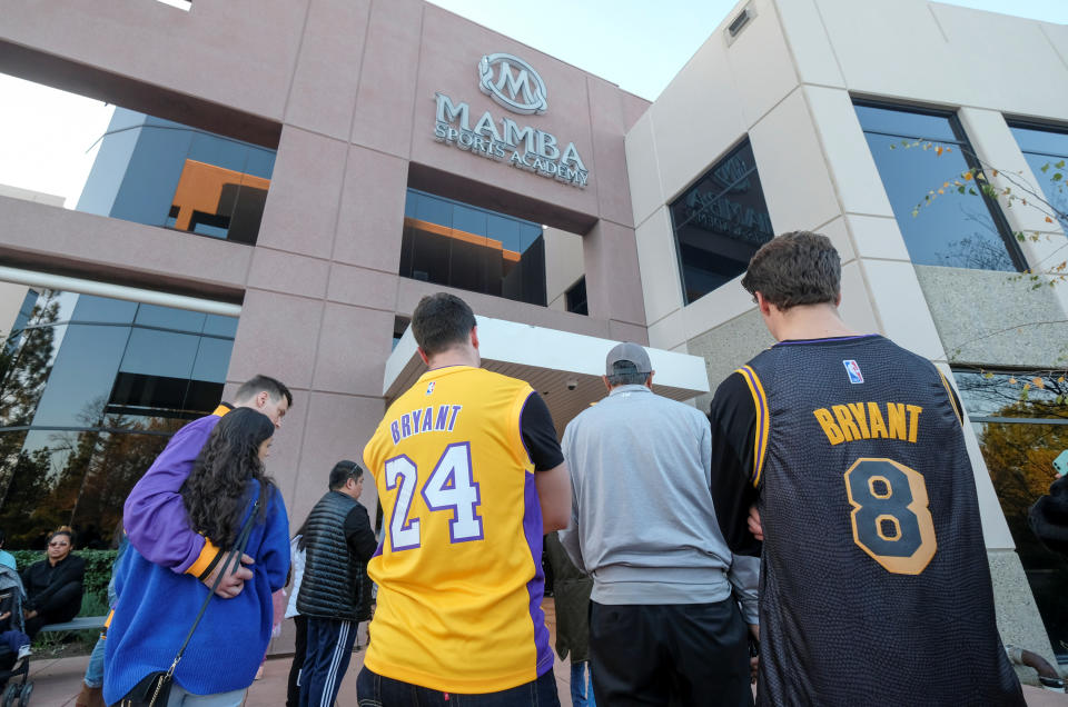 Fans gather at a makeshift memorial for former NBA player Kobe Bryant outside of the Mamba Sports Academy in Thousand Oaks, California, U.S., January 26, 2020.  REUTERS/Ringo Chiu