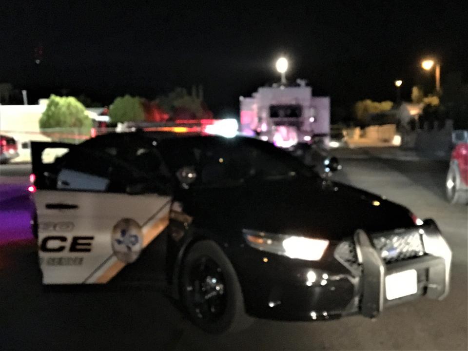 An El Paso police car and the police mobile command vehicle at a crime scene. File art.