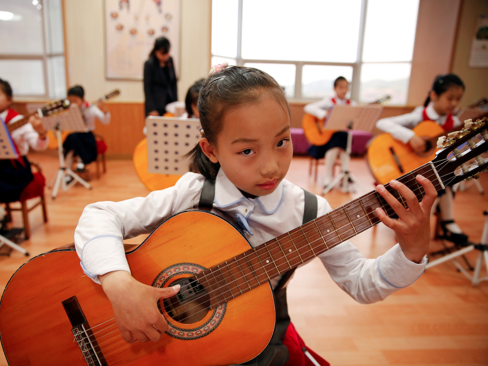 girl playing guitar