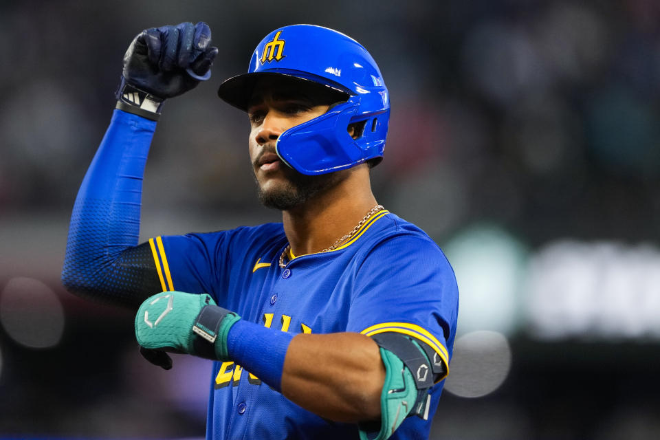 Seattle Mariners' Julio Rodríguez reacts to hitting a single against the Boston Red Sox during the fourth inning of a baseball game Friday, March 29, 2024, in Seattle. (AP Photo/Lindsey Wasson)