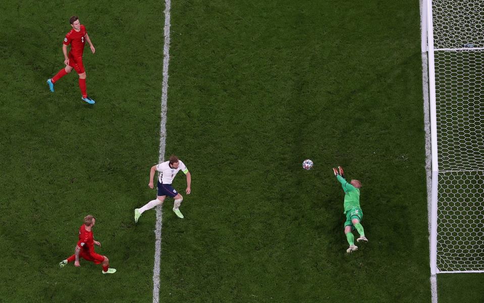 Harry Kane of England scores past Kasper Schmeichel of Denmark from the rebound of a missed penalty for their team's second goal during the UEFA Euro 2020 Championship Semi-final - Laurence Griffiths/Getty Images