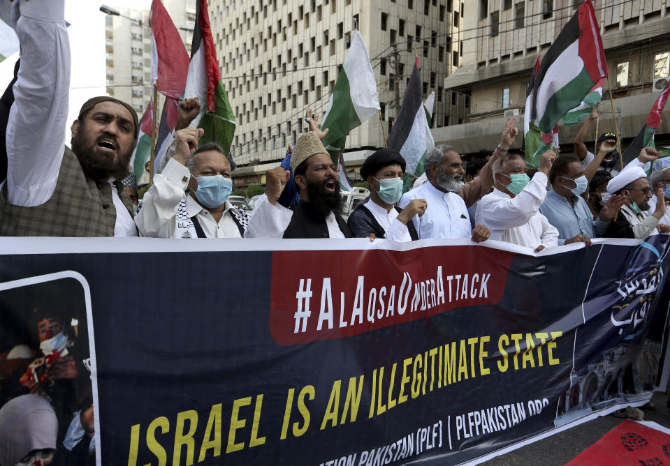 Members of a civil society group chant anti-Israeli slogans during a demonstration in support of Palestinians during the latest round of violence in Jerusalem, in Karachi, Pakistan, Tuesday, May 11, 2021. (AP Photo/Fareed Khan)