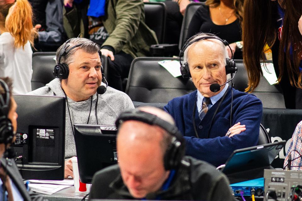 Detroit Pistons radio play-by-play voice Mark Champion, right, during a game.