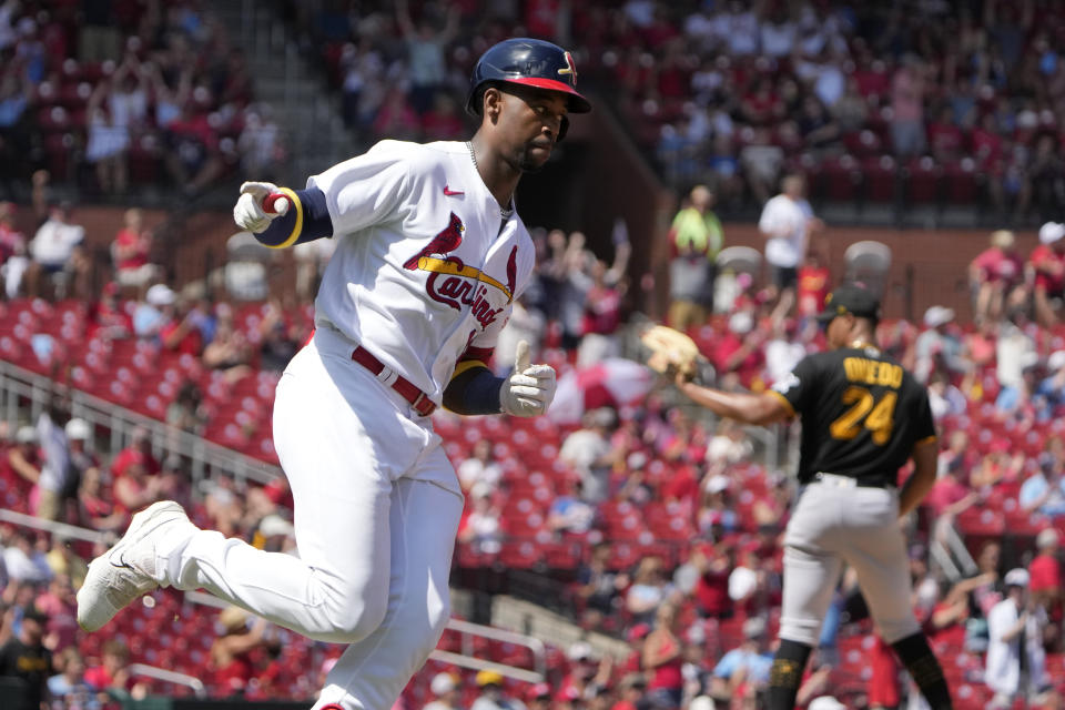 St. Louis Cardinals' Jordan Walker, left, celebrates after hitting a solo home run off Pittsburgh Pirates starting pitcher Johan Oviedo (24) during the third inning of a baseball game Sunday, Sept. 3, 2023, in St. Louis. (AP Photo/Jeff Roberson)