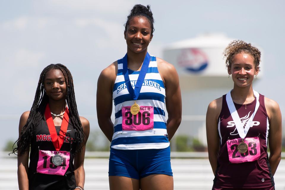 Spring Grove's Laila Campbell stands atop the awards podium after winning her second gold medal of the weekend at the PIAA District 3 Track and Field Championships on Saturday, May 21, 2022, at Shippensburg University. 