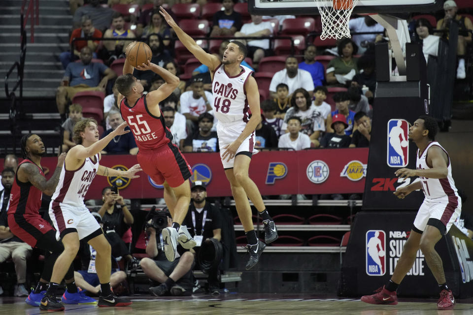 Houston Rockets' Fletcher Magee attempts a shot against Cleveland Cavaliers' Pete Nance (48) during the first half of a NBA summer league championship basketball game Monday, July 17, 2023, in Las Vegas. (AP Photo/John Locher)