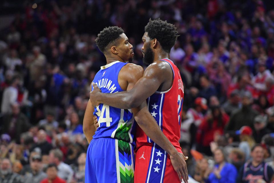 Milwaukee Bucks forward Giannis Antetokounmpo (34) and Philadelphia 76ers center Joel Embiid (21) congratulate each other after game at Wells Fargo Center.