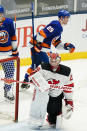 New Jersey Devils goaltender Mackenzie Blackwood (29) reacts as New York Islanders' Brock Nelson (29) skates toward his bench after scoring a goal during the second period of an NHL hockey game Saturday, May 8, 2021, in Uniondale, N.Y. (AP Photo/Frank Franklin II)