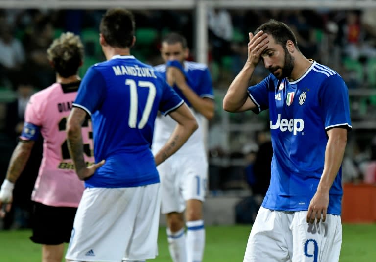 Juventus' forward Gonzalo Higuain reacts during an Italian Serie A football match against Palermo on September 24, 2016